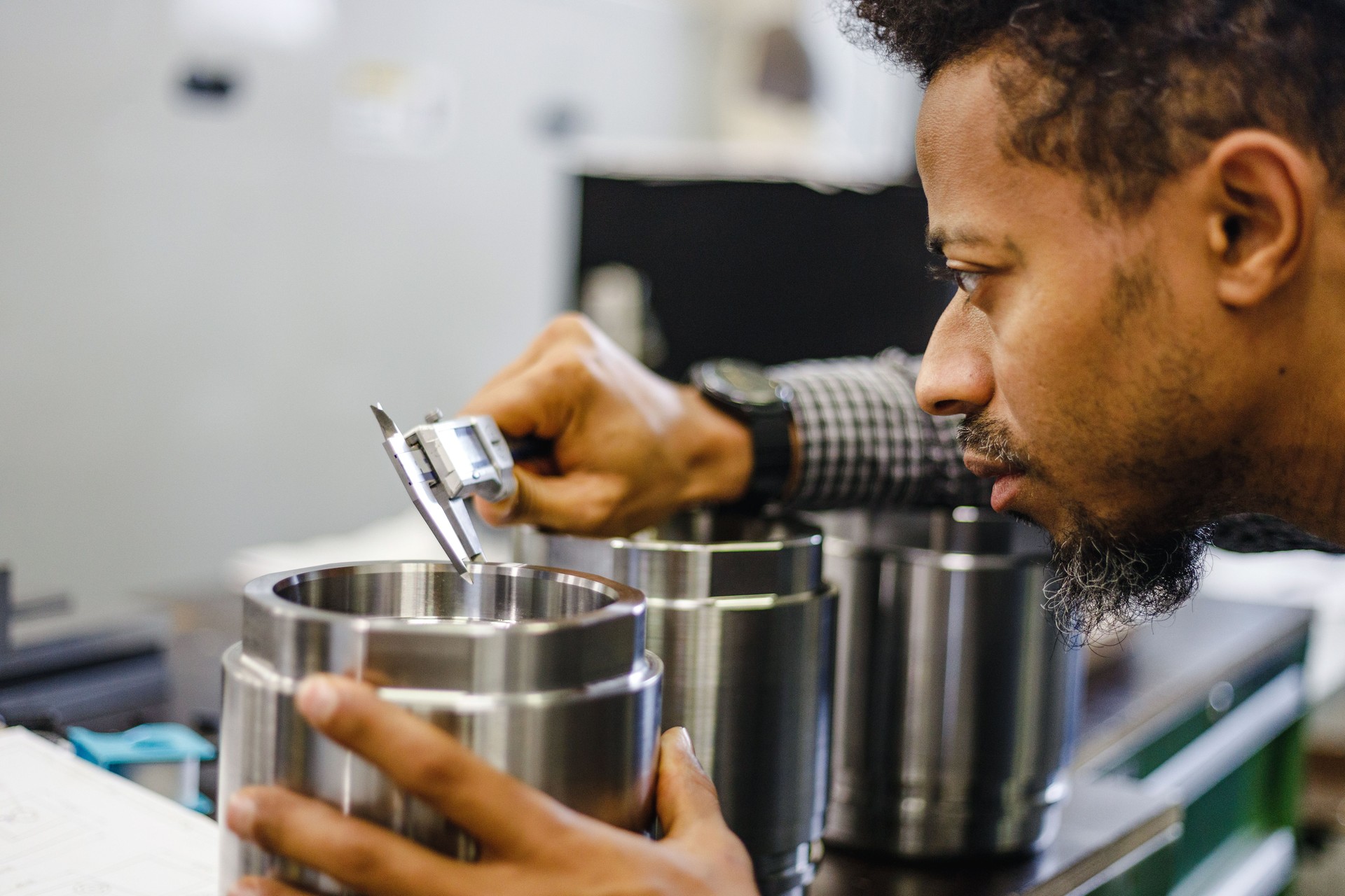 Adult Mixed Male Quality Control Manager Carrying Out Product Inspection